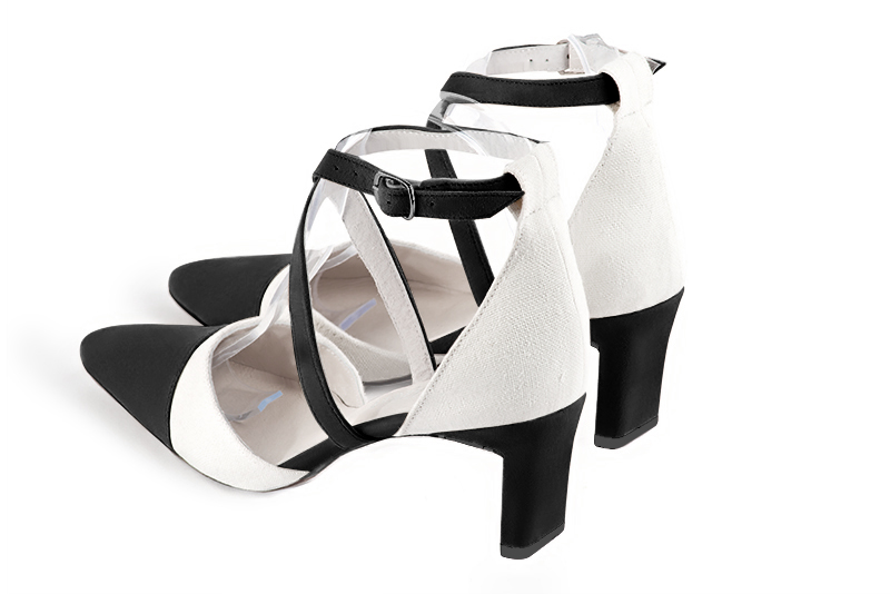 Matt black and off white women's open side shoes, with crossed straps. Tapered toe. Medium comma heels. Rear view - Florence KOOIJMAN